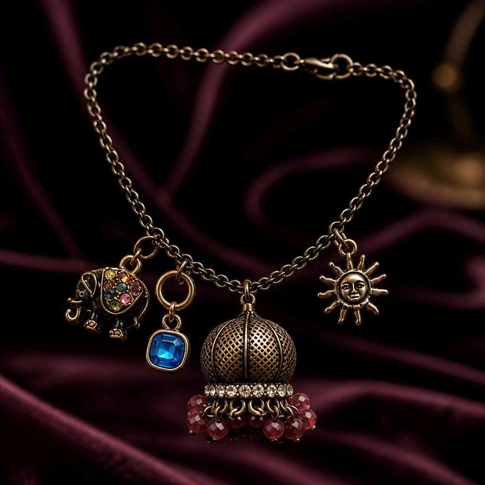Vintage-Style Antique Gold Jhumka Charm Bracelet – Elephant, Sunburst, and Cryst